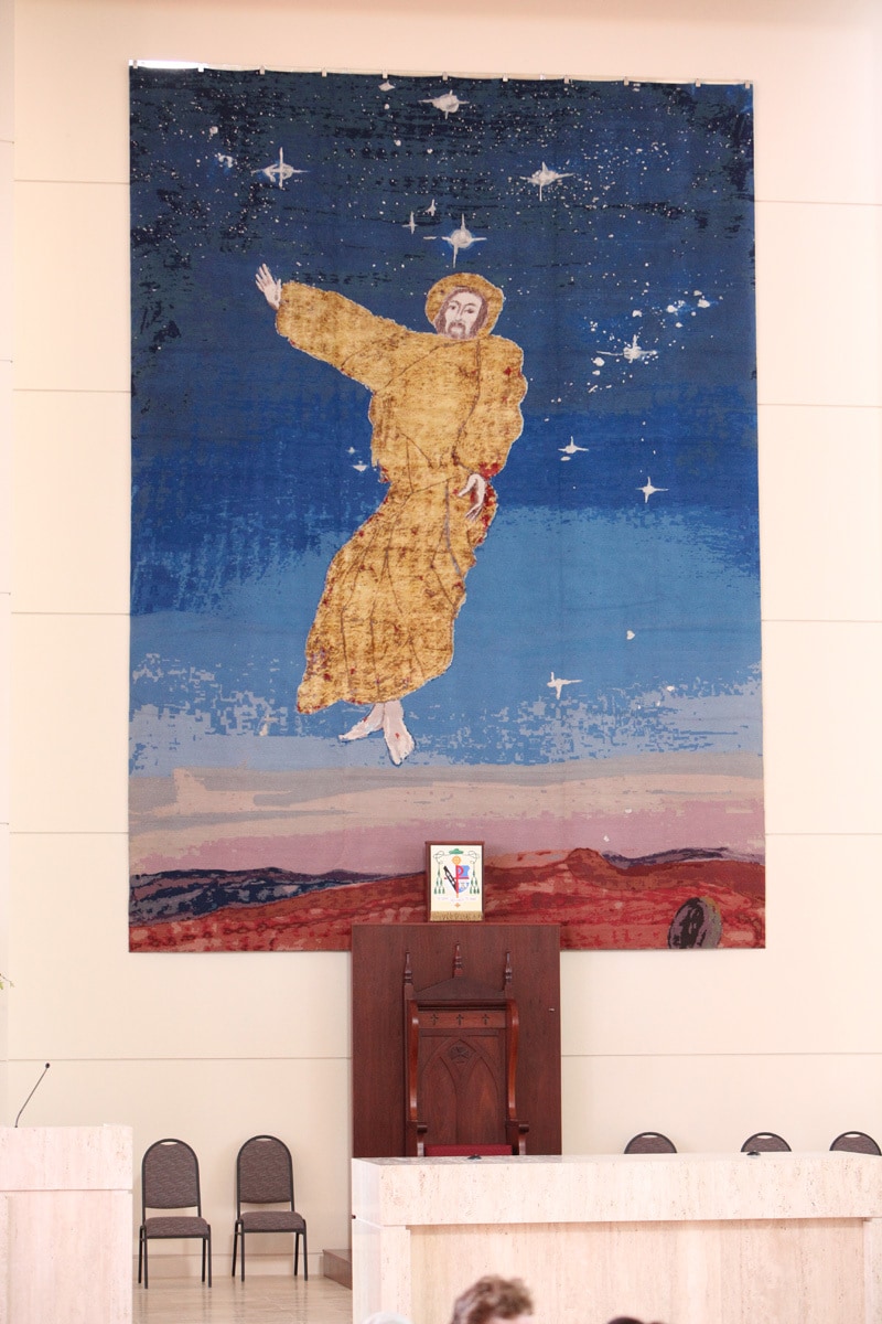 Above the Cathedra, is the Resurrection Tapestry. Based on a painting by Australian artist, Robert Juniper, the tapestry was hand woven in Nepal. The image of Jesus is woven from gold silk, and the tapestry weighs approximately 80kg. The Tapestry depicts Jesus rising from the tomb, which can be seen in the bottom right hand corner. The Resurrection Tapestry is a powerful reminder for us of Christ’s victory over death.