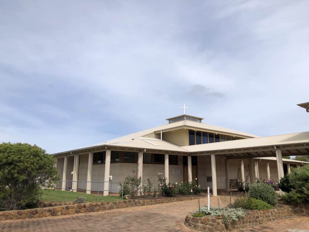 Modern Catholic church building with a cross on top in Bunbury, Australia.
