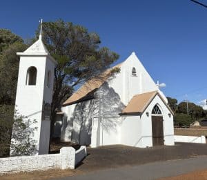 Historic white church with bell tower in Bunbury, Western Australia.