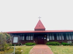 Bunbury Catholic Diocese church with red roof and cross in Bunbury, Australia.
