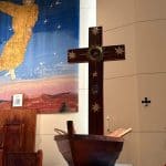 Interior of Bunbury Catholic Diocese with cross and religious symbols.