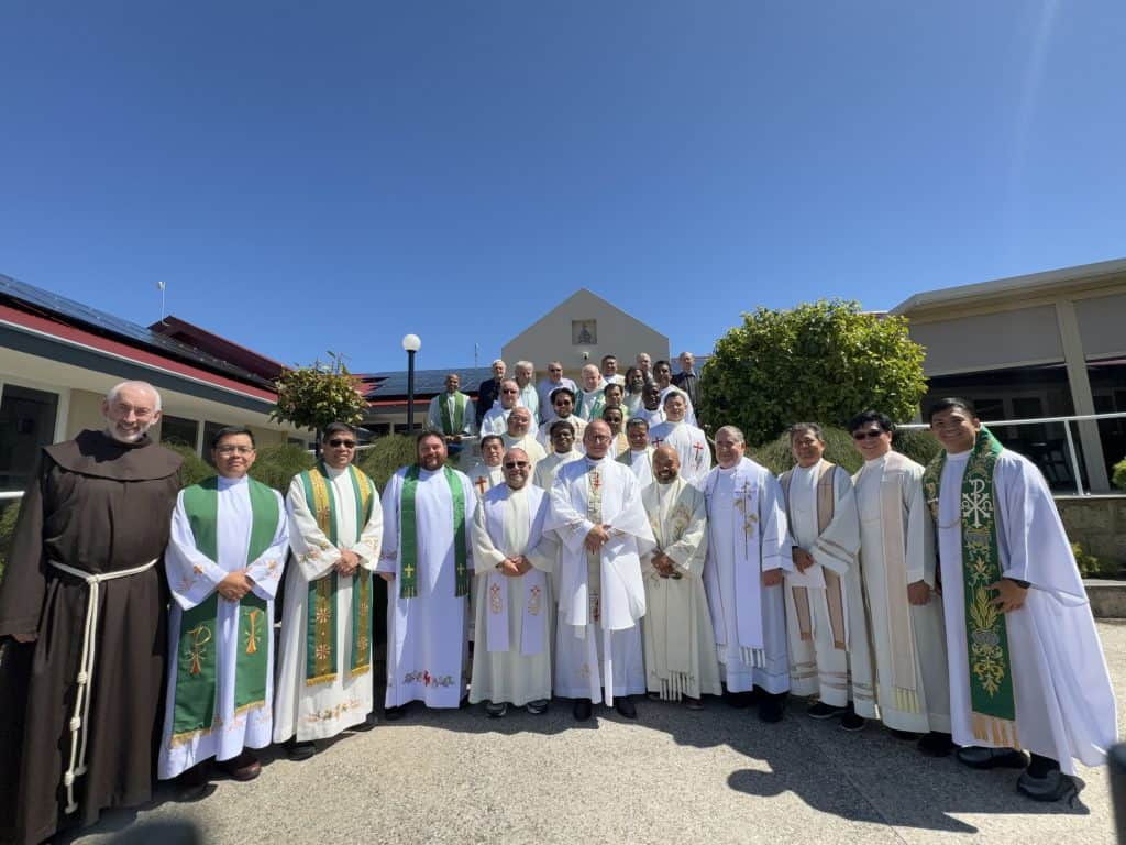 Group of clergy and religious priests outside Bunbury Catholic Church.