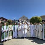 Group of clergy and religious priests outside Bunbury Catholic Church.