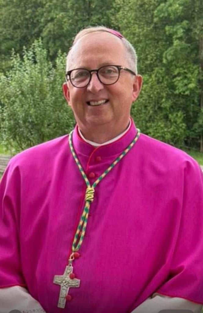 Bishop wearing pink vestments and cross necklace at Bunbury Catholic Diocese.