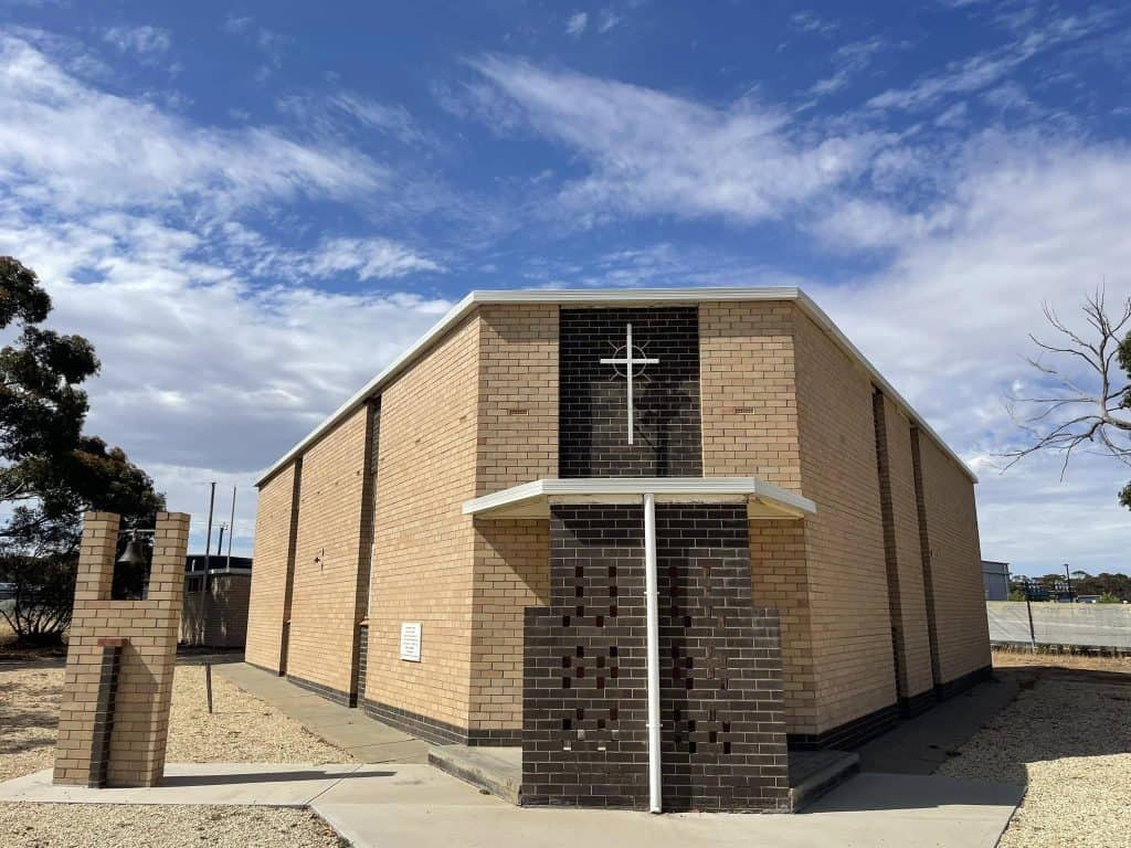 Bunbury Catholic Diocese church building with cross and modern brick design.